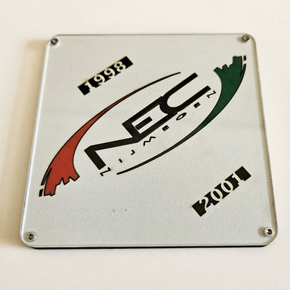 NEC onderzetter met historisch logo uit de periode 1998 tot 2001